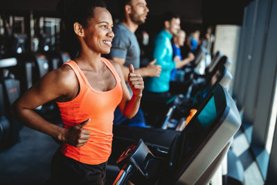 People On Treadmills At Gym
