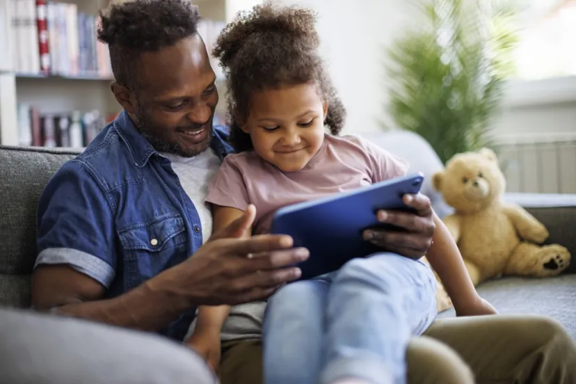 Father And Daughter Using Tablet
