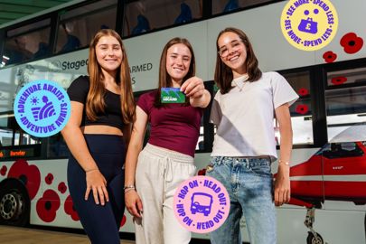 Three Girls Stood Outside A Bus At The Interchange With One Of Them Holding The Brand New Barnsley Micard