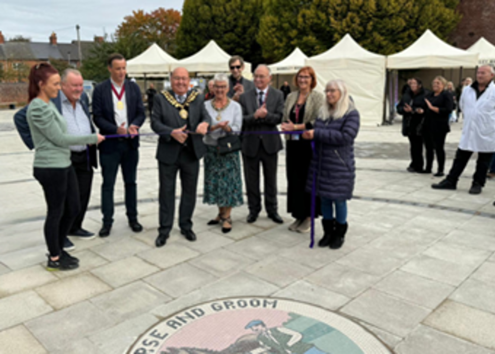 The Mayor Cutting The Ribbon At The Official Opening Of The Town Square