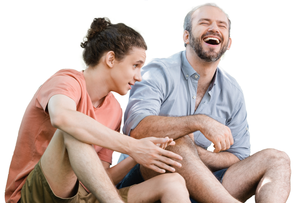 Man and teenage boy sat joking around