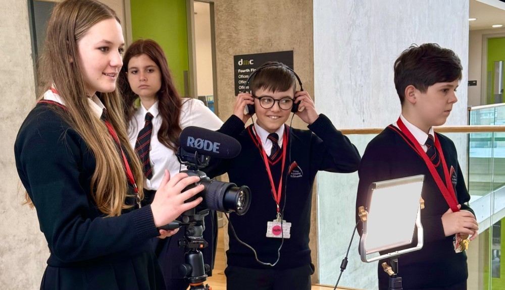 Group of pupils with camera