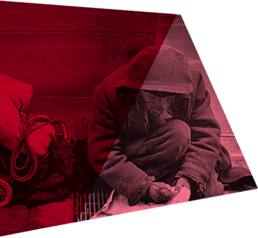 Homeless person writing a note