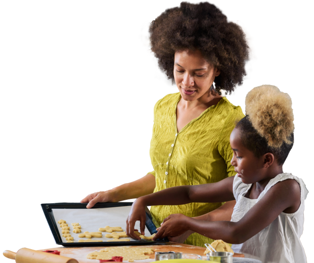 Woman and young girl baking buscuits