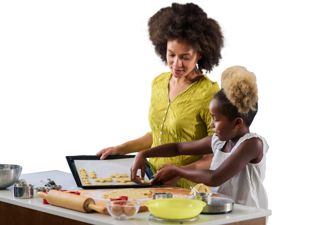 Woman and young girl baking biscuits