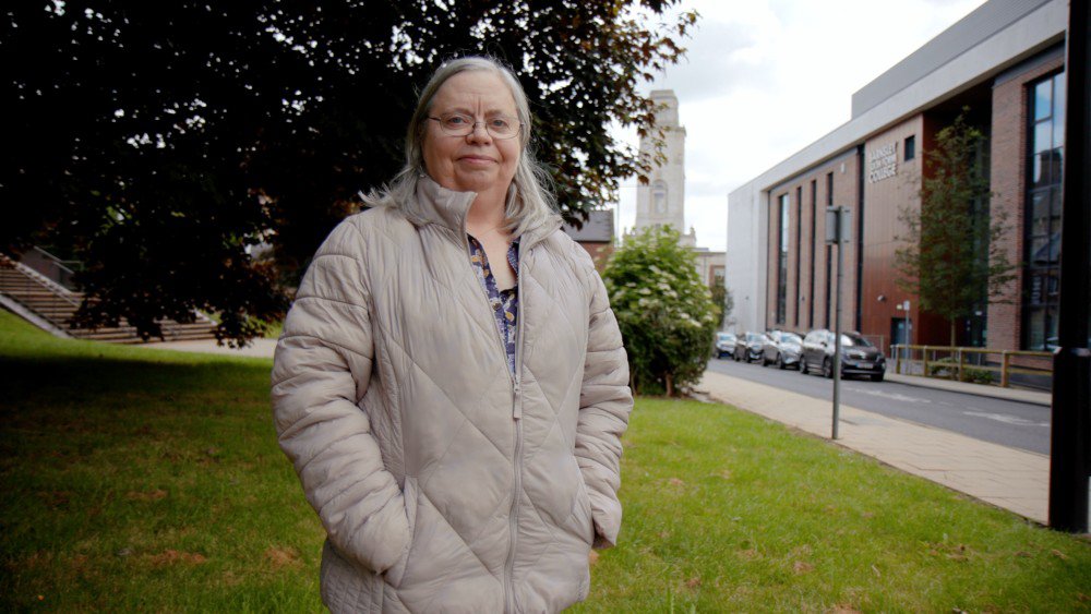 Woman with Town Hall behind