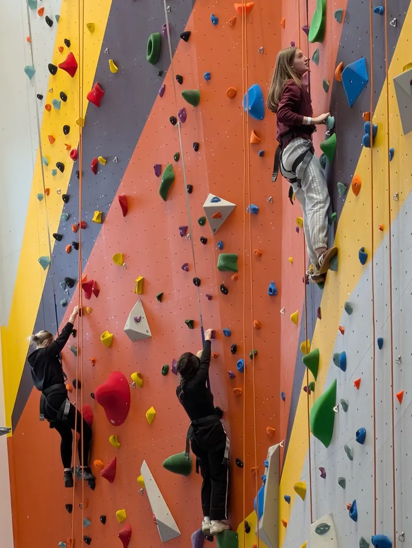 Girls on climbing wall at Base 71