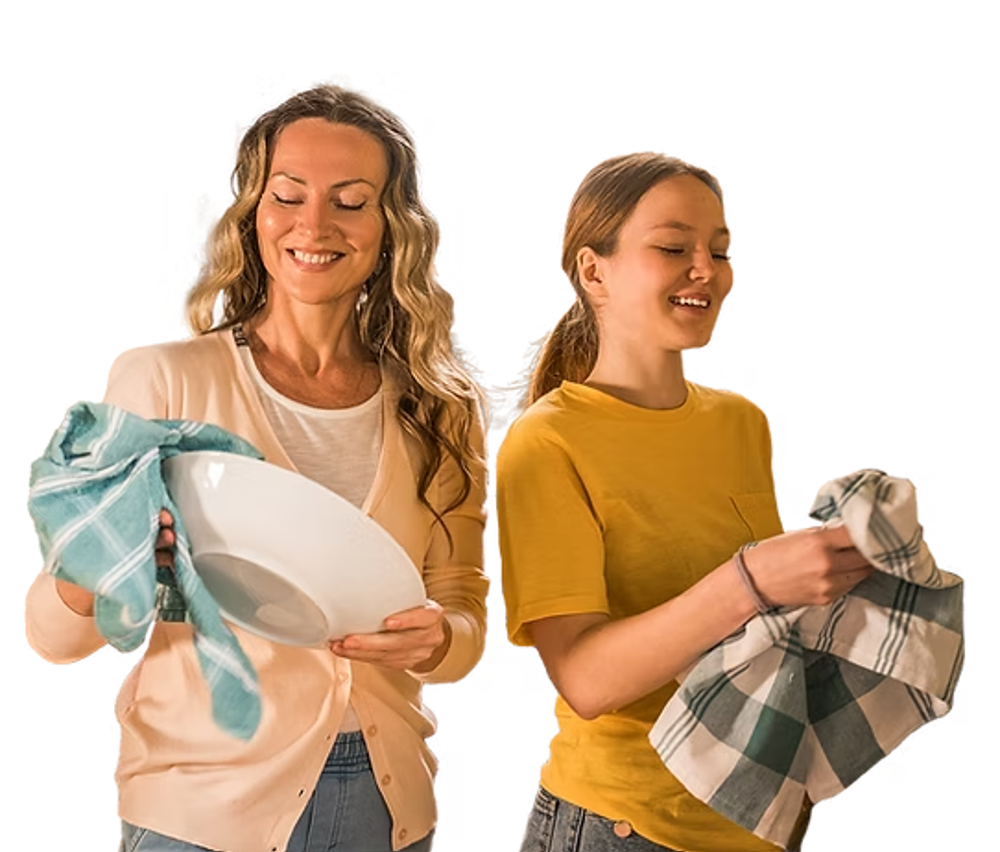 woman and girl washing the dishes