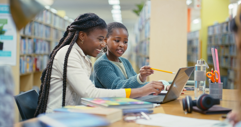 Mother helping daughter with homework