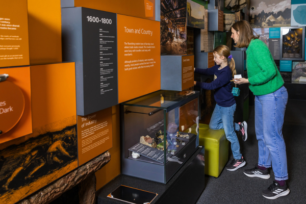 Mum and child explore exhibits in Experience Barnsley Museum.png