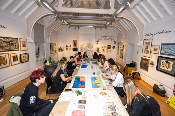 A Group Of Young People Creating Artwork In The Sadler Room At Cooper Gallery