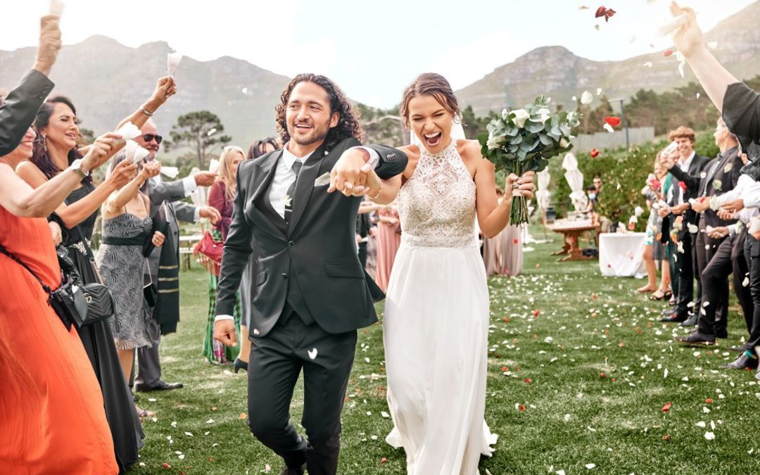 Bride and groom getting married outside