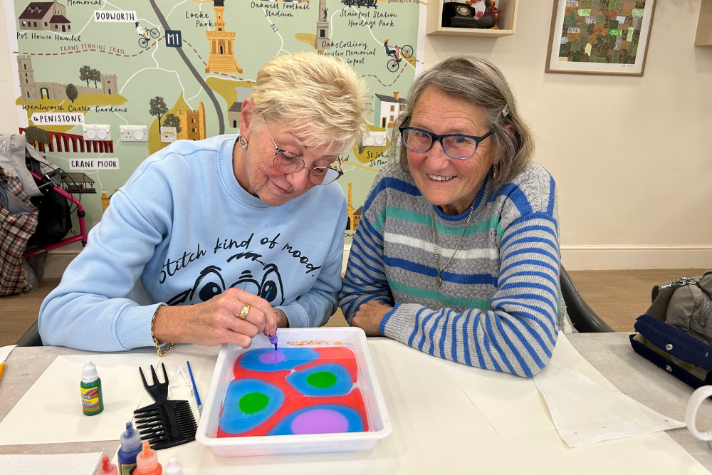 Two Women Creating Artwork In The Shared Horizon Project Two Women Creating Artwork In The Shared Horizon Project