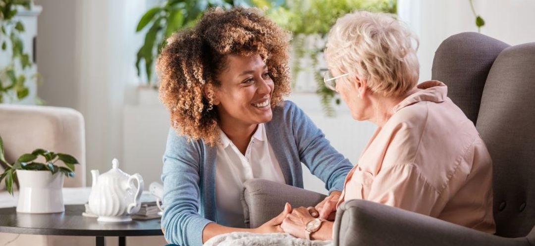 Carer talking to older lady