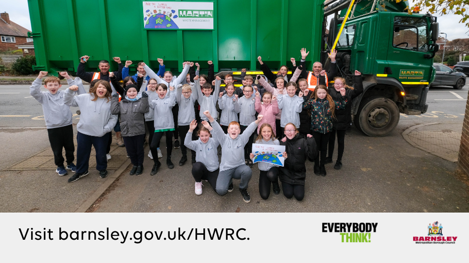 Winners of recycling poster competition stood in front of a skip truck. Visit barnsley.gov.uk/HMRC.