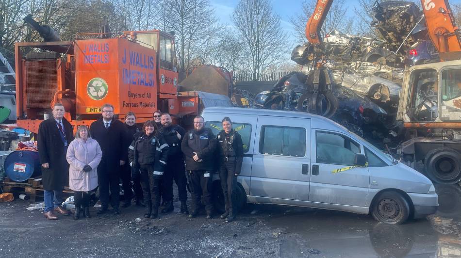 Enforcement officers and councillors stood in front of a van