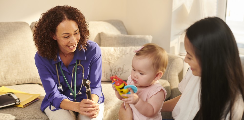 Health Visitor With Parent And Child