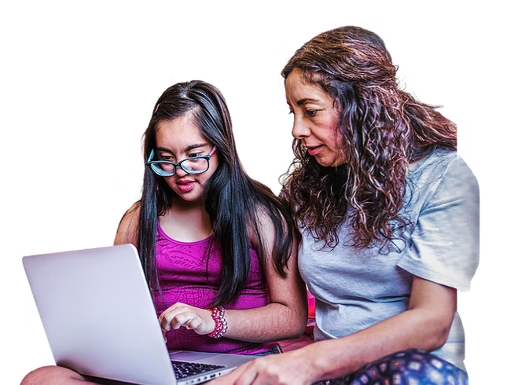 Woman and young girl with disability on a laptop