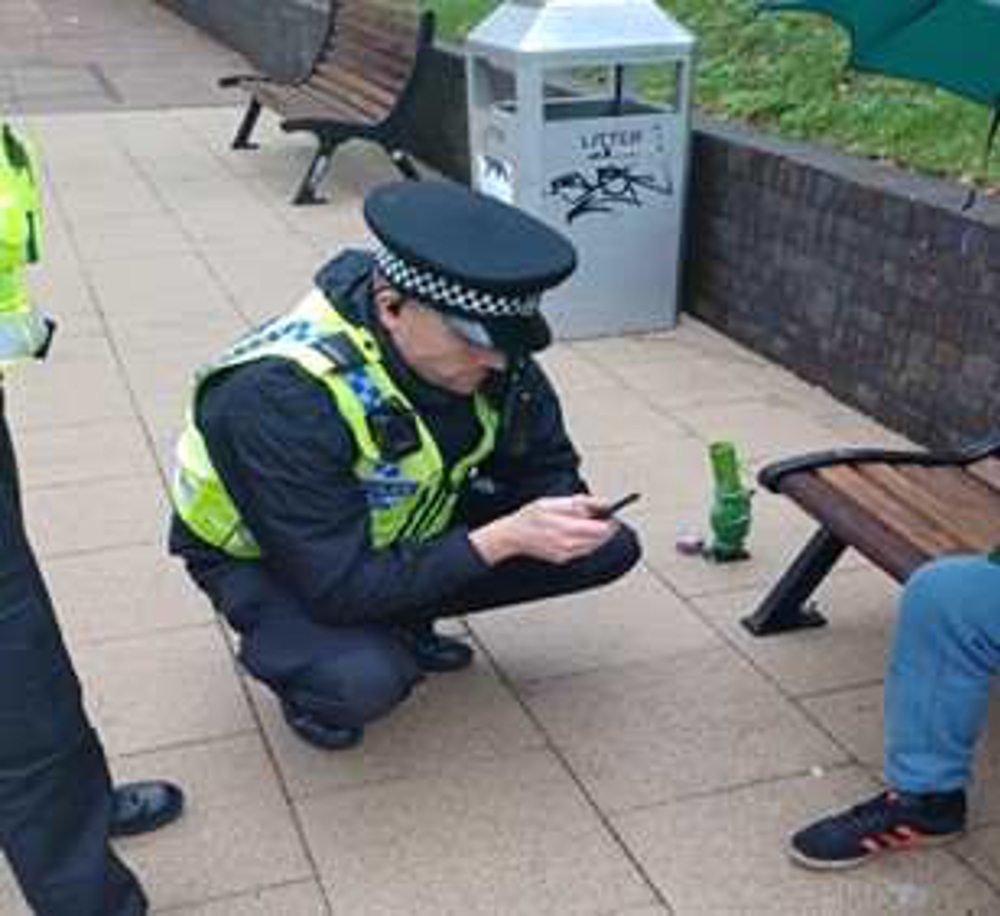 Police Officer Talking To A Man With A Bong