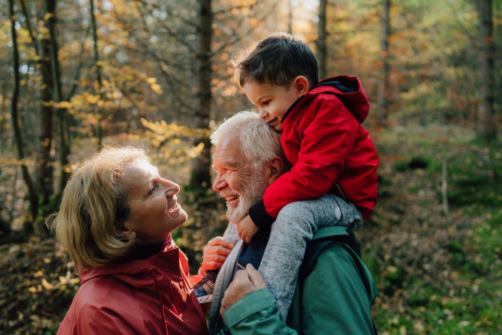 Elderly Couple And Child On Walk